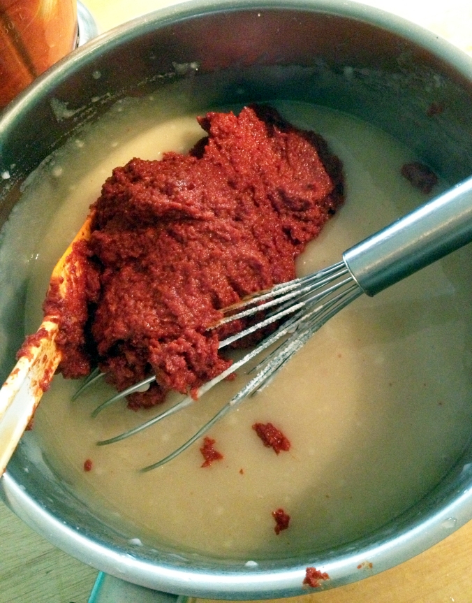 The red pepper pasted gets added to a cooked mixture of mochiko flour, sugar and water, and gets blended to make the kimchi paste